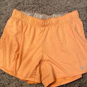 Nike peach color Dri-fit athletic shorts